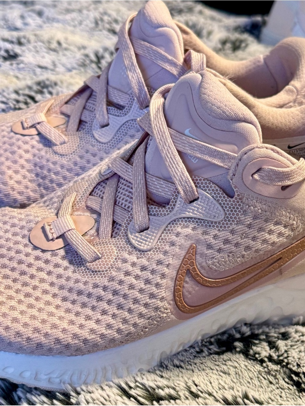 Nike Women’s Light Pink Running Sneakers with Rose Gold Swoosh